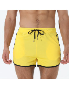 короткі жовті чоловічі спортивні шорти з кишенями на блискавці